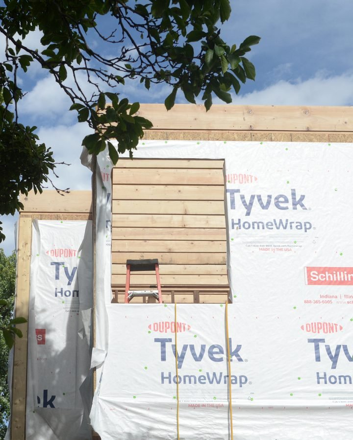 Wood-framed house wrapped in house wrap during construction